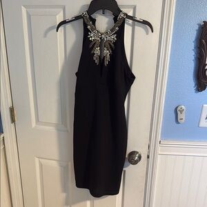 Elegant Black Halter Dress with Embellished Neckline